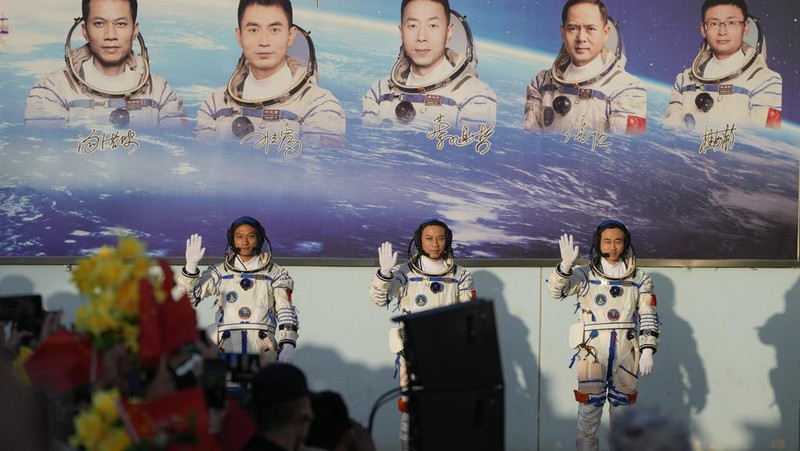 Chinese astronauts for the Shenzhou-17 mission, from left, Jiang Xinlin, Tang Hongbo and Tang Shengjie wave as they arrive for a send-off ceremony for their manned space mission at the Jiuquan Satellite Launch Center in northwestern China, Thursday, Oct. 26, 2023. (AP Photo/Andy Wong)