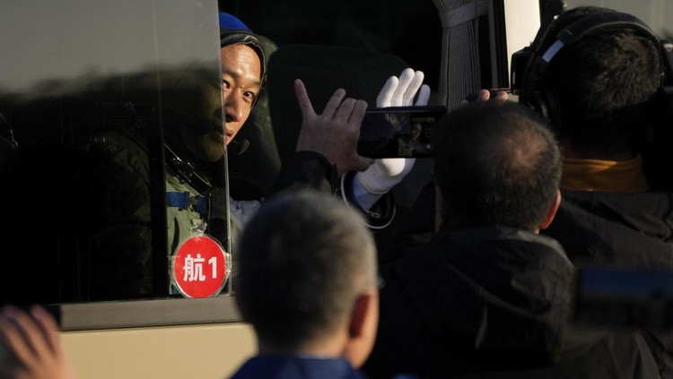 Chinese astronauts for the Shenzhou-17 mission, from left, Jiang Xinlin, Tang Hongbo and Tang Shengjie wave as they arrive for a send-off ceremony for their manned space mission at the Jiuquan Satellite Launch Center in northwestern China, Thursday, Oct. 26, 2023. (AP Photo/Andy Wong)