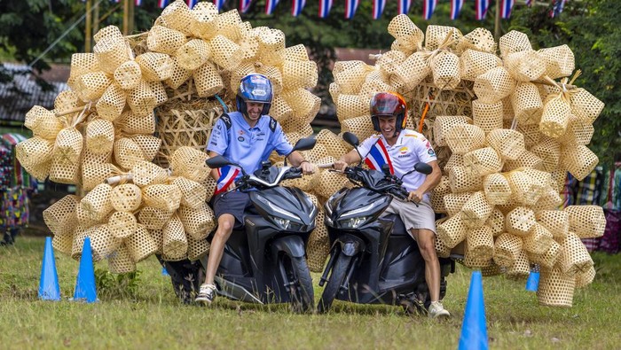 Marc and Alex Marquez race with bamboo baskets in Buriram, Thailand, on October 25, 2023. // Sean Chen / Red Bull Content Pool // SI202310252488 // Usage for editorial use only //