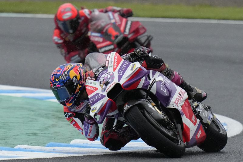 Spain's Jorge Martin, front, steers his motorcycle, chased by Italy's Francesco Bagnaia, on his way to winning the MotoGP race of Japanese Motorcycle Grand Prix at the Twin Ring Motegi circuit in Motegi, north of Tokyo Sunday, Oct. 1, 2023.(AP Photo/Shuji Kajiyama)