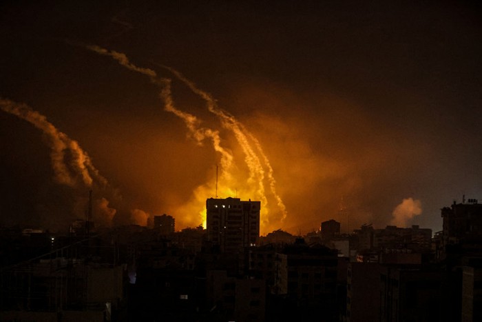 GAZA STRIP, GAZA - OCTOBER 28: Smoke rises and billows in different regions of Gaza as the Israeli army conducts the most intense air attacks on the 21st day in Gaza Strip, Gaza on October 28, 2023. Due to Israel cutting off electricity and not allowing fuel supplies, Gaza was plunged into darkness, and the sky was frequently illuminated by the bombs being dropped by Israeli aircraft. (Photo by Ali Jadallah/Anadolu via Getty Images)
