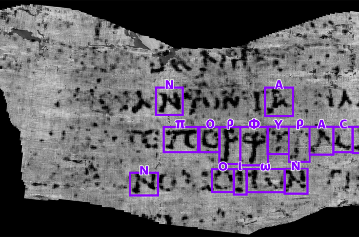 Huruf-huruf yang berhasil dipecahkan mahasiswa jurusan ilmu komputer Luke Farritor dari gulungan kuno Herculaneum. Farritor memanfaatkan machine learning untuk membaca huruf-huruf tersebut.