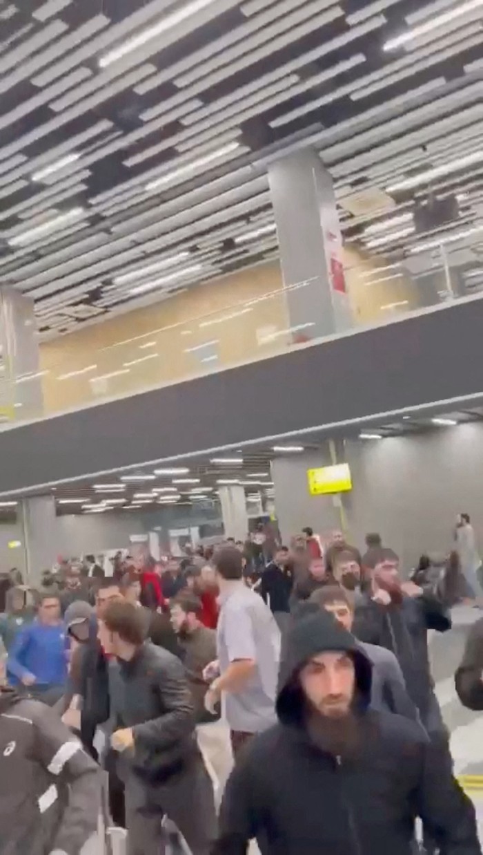 People walk as Pro-Palestinian protesters storm an airport building, in Makhachkala, Russia, October 29, 2023, in this screengrab taken from a video obtained by Reuters. Video Obtained by Reuters/via REUTERS THIS IMAGE HAS BEEN SUPPLIED BY A THIRD PARTY. MANDATORY CREDIT. NO RESALES. NO ARCHIVES.