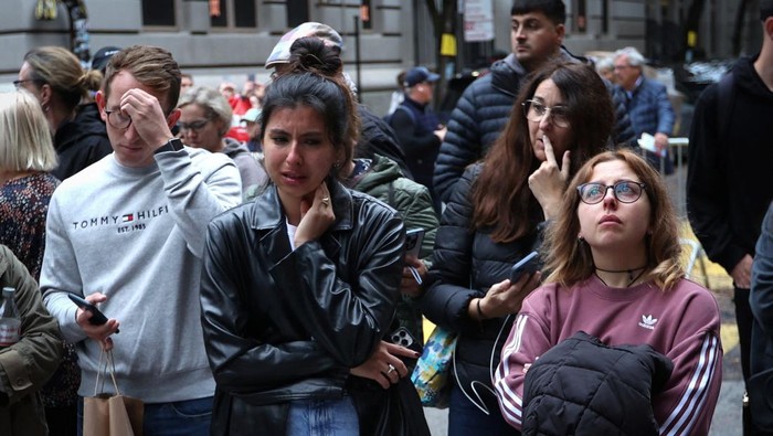 People gather near a makeshift memorial for actor Matthew Perry, the wise-cracking co-star of the 1990s hit television sitcom 