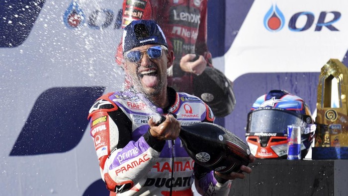 MotoGP winner Spains Jorge Martin, sprays champagne on the podium, after the MotoGP race at the Chang International Circuit in Buriram, Thailand, Sunday, Oct. 29, 2023. (AP Photo/ Kittinun Rodsupan)