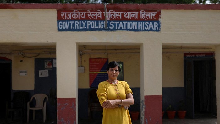 Medals hang from a photo of Indian Freedom Fighter, Chandra Shekhar Azad, in a room at the Altius wrestling school's boarding hostel in Sisai, Haryana, India, July 9, 2023. Two dozen girls and young women train in the school, which is covered by State government funding covering, while some of the parents pay about 9,100 rupees ($109) a month for board and academic tuition, provided by a school next-door. 
