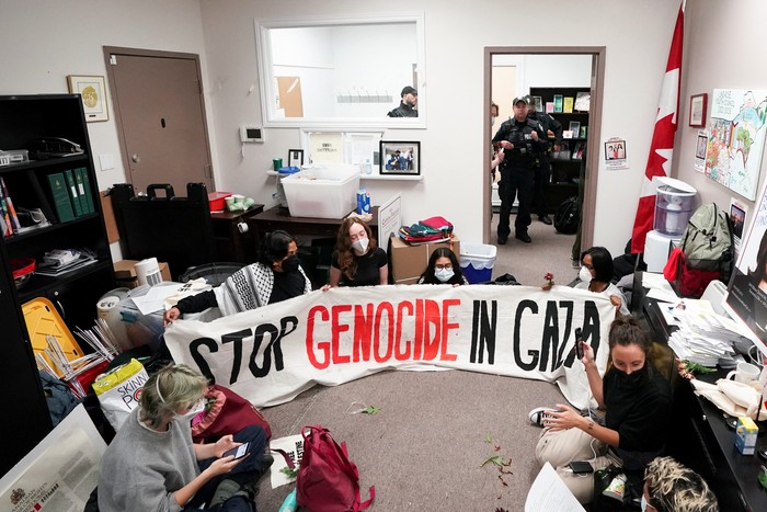 Supporters of Palestinian rights, calling for a ceasefire and end to the siege in Gaza, stand outside the constituent office of Canadas Deputy Prime Minister and Finance Minister Chrystia Freeland in Toronto, Ontario, Canada October 30, 2023. REUTERS/Arlyn McAdorey