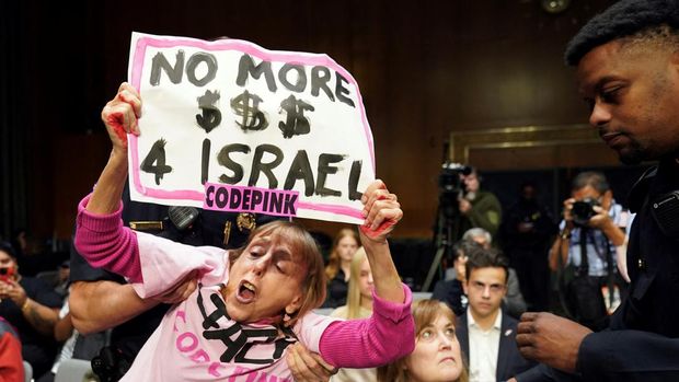 An anti-war protester is removed by police during a Senate Appropriations Committee hearing on President Biden's $106 billion national security supplemental funding request to support Israel and Ukraine, as well as bolster border security, with testimony by U.S. Secretary of State Antony Blinken and Secretary of Defense Lloyd Austin, on Capitol Hill in Washington, U.S., October 31, 2023. REUTERS/Kevin Lamarque