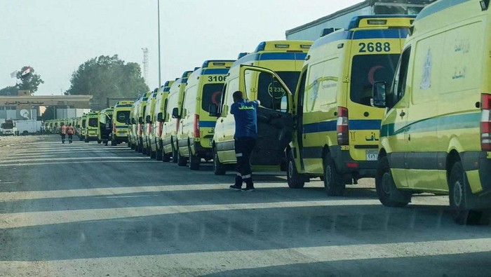 Security guards check an Egyptian ambulance carrying critically injured Palestinians as they arrive at Al-Arish hospital through the Rafah border crossing, amid the ongoing conflict between Israel and the Palestinian Islamist group Hamas in the city of Al-Arish, Sinai Peninsula, Egypt November 1, 2023. REUTERS/Stringer
