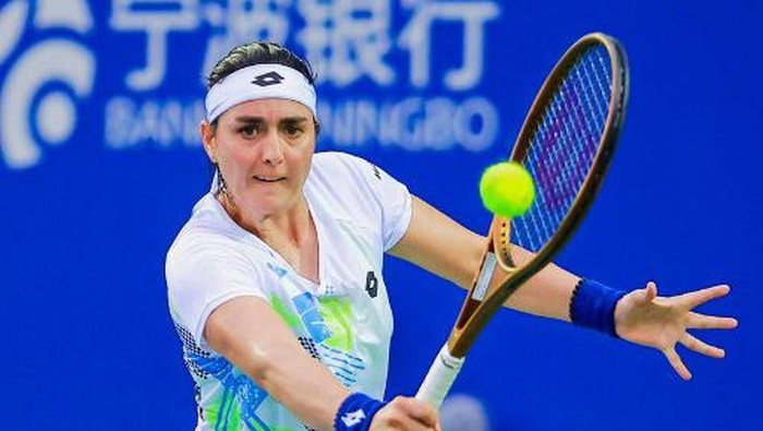 Tunisias Ons Jabeur hits a return against Russias Diana Shnaider during the womens singles final match at the WTA Ningbo Open tennis tournament in Ningbo, in Chinas eastern Zhejiang province on September 30, 2023. (Photo by AFP) / China OUT