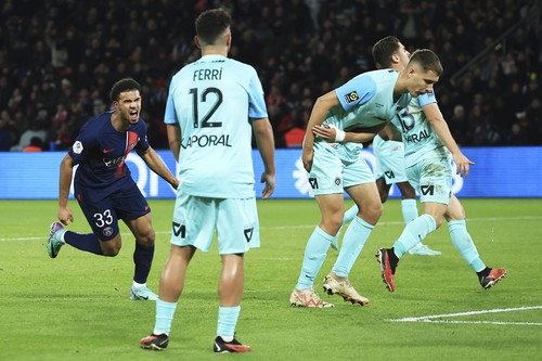 PSGs Warren Zaire-Emery, left, celebrates after scoring his sides second goal during the French League One soccer match between Paris Saint Germain and Montpellier at Parc des Princes stadium in Paris, France, Friday, Oct. 3, 2023. (AP Photo/Aurelien Morissard)