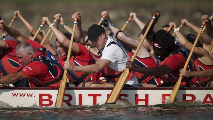 Britain's Prince William, center, participates in a dragon boat event in Singapore, Monday, Nov. 6, 2023. (AP Photo/Vincent Thian)