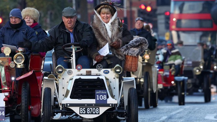 Participants drive over Westminster Bridge as they compete in the London to Brighton Veteran Car Run, for vehicles built before 1905, in London, Britain, November 5, 2023. REUTERS/Toby Melville