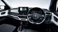 Masuk ke bagian dalam, pabrikan membekalinya dengan layar sentuh hiburan berukuran 9 inch. Sementara instrument cluster-nya diganti dengan layar kecil di antara dial analog. Interior kendaraan tersebut turut dihiasai pengatur suhu baru, slot CD, cupholder, soket USD dan rem tangan elektrik dengan fungsi auto-hold. Foto: Doc. Suzuki