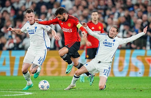 Soccer Football - Champions League - Group A - FC Copenhagen v Manchester United - Telia Parken, Copenhagen, Denmark - November 8, 2023 Manchester Uniteds Bruno Fernandes in action with FC Copenhagens Lukas Lerager and Rasmus Falk Liselotte Sabroe/Ritzau Scanpix via REUTERS      ATTENTION EDITORS - THIS IMAGE WAS PROVIDED BY A THIRD PARTY. DENMARK OUT. NO COMMERCIAL OR EDITORIAL SALES IN DENMARK.