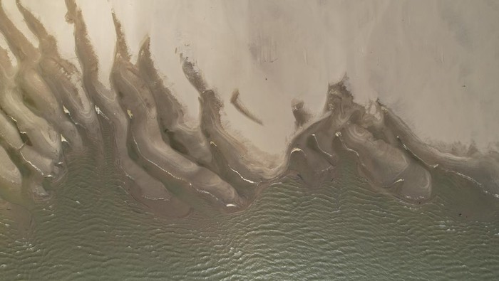 The Ohio River, right, flows into the Mississippi River, left, Wednesday, Nov. 8, 2023, near Cairo, Ill. Parts of the Mississippi River have been at historic lows after drought conditions have persisted this fall. (AP Photo/Joshua A. Bickel)