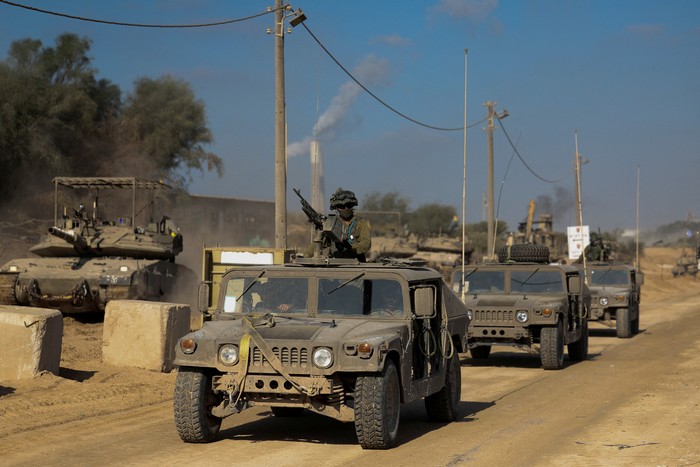 Israeli soldiers walk through rubble, amid the ongoing ground invasion against Palestinian Islamist group Hamas in the northern Gaza Strip, November 8, 2023. REUTERS/Ronen Zvulun.  EDITOR’S NOTE: REUTERS PHOTOGRAPHS WERE REVIEWED BY THE IDF AS PART OF THE CONDITIONS OF THE EMBED. NO PHOTOS WERE REMOVED.