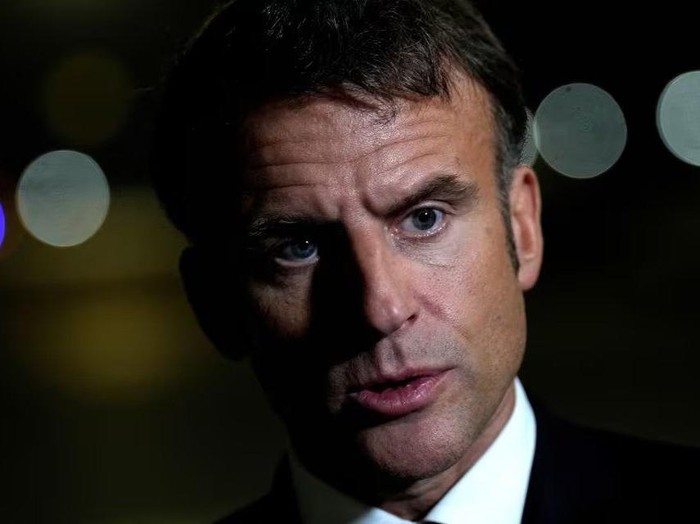 French President Emmanuel Macron talks to journalists on the tarmac of Cairo airport, Egypt, as he departs Wednesday, Oct. 25, 2023. Christophe Ena/Pool via REUTERS/File Photo Acquire Licensing Rights