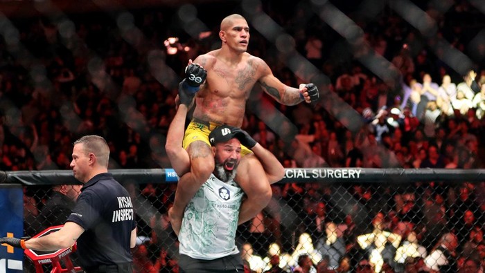 Nov 11, 2023; New York, NY, USA; Alex Pereira (blue gloves) celebrates after beating Jiri Prochazka (red gloves) during UFC 295 at Madison Square Garden. Mandatory Credit: Wendell Cruz-USA TODAY Sports