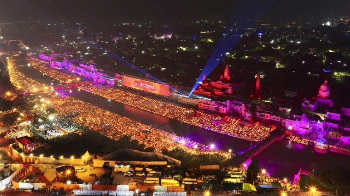 Lamps light up the banks of the river Saryu on the eve of the Hindu festival of Diwali, in Ayodhya, India, Saturday, Nov. 11, 2023. Ayodhya city in the northern Indian state of Uttar Pradesh Saturday set a record by lighting over 2.2 million earthen oil lamps during Deepotsav celebrations on the eve of Diwali, creating a new Guinness World Record for lighting lamps in such a large number, according to state tourism department. (AP Photo/Rajesh Kumar Singh)