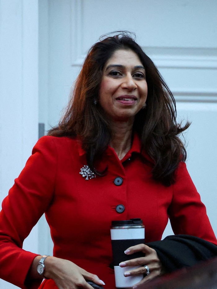 Britain's Home Secretary Suella Braverman walks outside her home, in London, Britain, November 13, 2023. REUTERS/Toby Melville