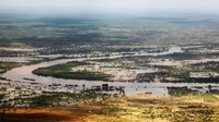 Banjir merendam permukiman dan lahan pertanian.
