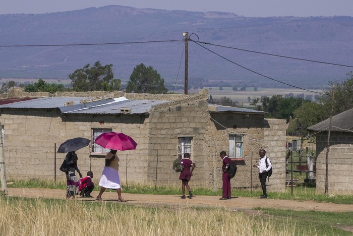 A group of school children from Ubusi Combined School play along the way as they prepare to embark on their walk back to their various homes at the end of the day near Dundee, South Africa, Thursday, Oct. 26, 2023. Thousands of children in South Africas poorest and most remote rural communities still face a miles-long walk to school, nearly 30 years after the country ushered in democratic change. (AP Photo/ Sebabatso Mosamo)