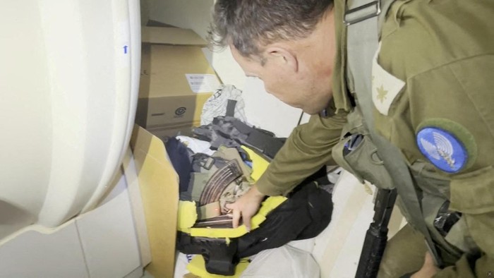 An Israeli officer shows a rifle that he says was discovered in a bag stored in a cabinet containing medical supplies at the Al Shifa hospital complex, amid the Israeli militarys ground operation against Palestinian Islamist group Hamas, in Gaza City, November 15, 2023 in this still image taken from video. Israeli forces said the 