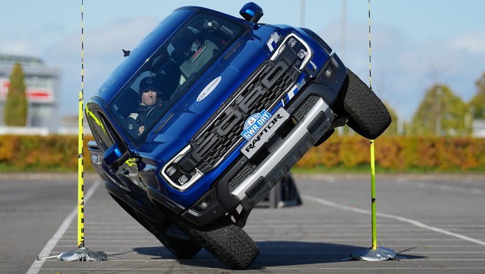 Paul Swift achieves the Guinness World Record for 'The tightest gap (44cm) driven through on two wheels in a pick up truck' in Silverstone, Britain November 9, 2023 in this handout picture released in celebration of Guinness World Records Day 2023.  Guinness World Records Day 2023/Handout via REUTERS  ATTENTION EDITORS - THIS IMAGE HAS BEEN SUPPLIED BY A THIRD PARTY. NO RESALES. NO ARCHIVES. IMAGE FREE OF CHARGE FOR NEWS USAGE FOR TWO WEEKS FROM 16 NOVEMBER 2023 - NO NEW USE AFTER 0001GMT NOVEMBER 30, 2023. ENABLING CONTENT ID OR RIGHTS MANAGEMENT ON DIGITAL PLATFORMS IS NOT PERMITTED. MANDATORY CREDIT. IMAGES MUST NOT BE CROPPED OR ALTERED.