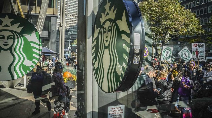 Starbucks workers and allies participate in a strike and picket organized by Starbucks Workers United during the companys Red Cup Day Thursday, Nov. 16, 2023, near Pike Place Market in Seattle. (AP Photo/Lindsey Wasson)