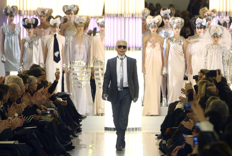 Chanel Haute Couture Spring 2010 German fashion designer Karl Lagerfeld acknowledges applause after Chanel's spring-summer 2010 Haute Couture fashion collection presented Tuesday Jan.26, 2010 in Paris. (AP Photo/Jacques Brinon)