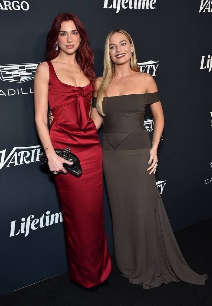 English-Albanian singer Dua Lipa (L) and Australian actress Margot Robbie arrive for Variety's Power of Women event at Mother Wolf in Los Angeles, California, on November 16, 2023. The 2023 honorees include US singer Fantasia Barrino, US singer-songwriter Billie Eilish, English actress Carey Mulligan, US actress Lily Gladstone, British actress Emily Blunt, and Margot Robbies LuckyChap. (Photo by LISA O'CONNOR / AFP)
