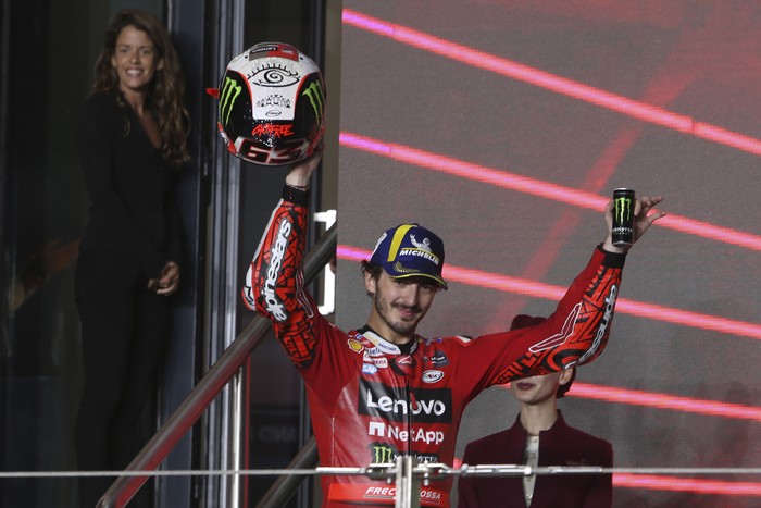 Second placed, Ducati rider Francesco Bagnaia, of Italy, celebrate on the podium end of the Qatari MotoGP Grand Prix at the Lusail International Circuit in Lusail, Qatar, Sunday, Nov. 19, 2023. (AP Photo/Hussein Sayed)