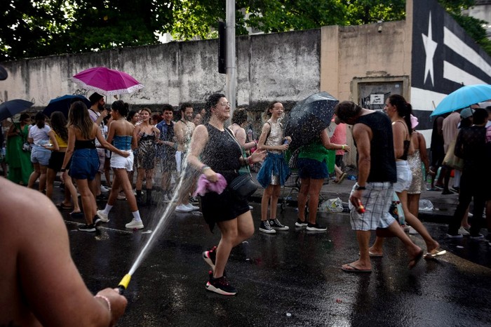 Fans of US singer Taylor Swift queue outside the Nilton Santos Olympic Stadium before Swift's concert, 
