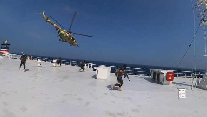 Houthi fighters open the door of the cockpit on the ships deck in the Red Sea in this photo released November 20, 2023. Houthi Military Media/Handout via REUTERS    THIS IMAGE HAS BEEN SUPPLIED BY A THIRD PARTY