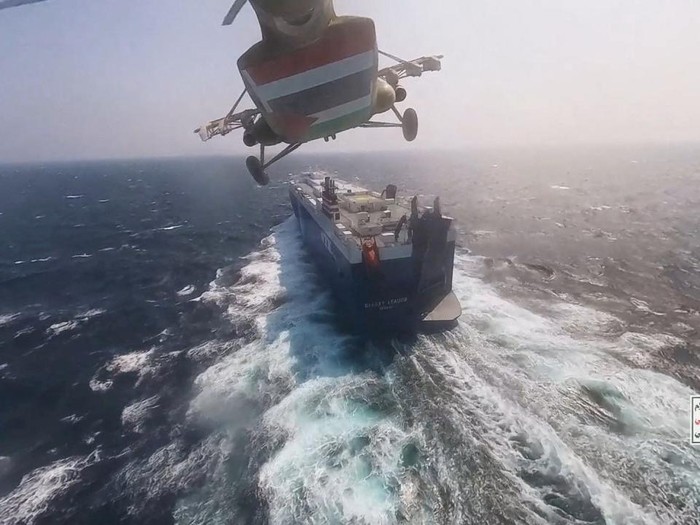 Houthi fighters open the door of the cockpit on the ships deck in the Red Sea in this photo released November 20, 2023. Houthi Military Media/Handout via REUTERS    THIS IMAGE HAS BEEN SUPPLIED BY A THIRD PARTY
