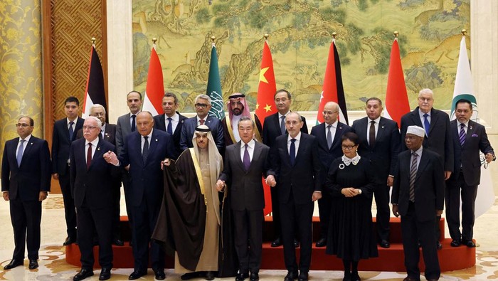Saudi Foreign Minister Prince Faisal bin Farhan and Palestinian Foreign Minister Riyad Al-Maliki wait for a family photo session at the Diaoyutai State Guesthouse in Beijing, China November 20, 2023. REUTERS/Florence Lo/Pool