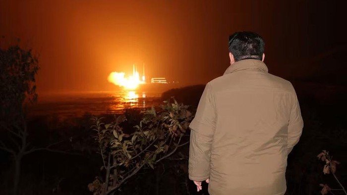 North Korean leader Kim Jong Un looks on as a rocket carrying a spy satellite Malligyong-1 is launched, as North Korean government claims, in a location given as North Gyeongsang Province, North Korea in this handout picture obtained by Reuters on November 21, 2023. KCNA via REUTERS Acquire Licensing Rights