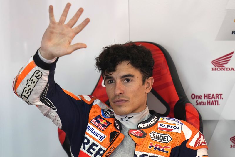 Spanish rider Marc Marquez waves to the spectators after the MotoGP qualification session for Sunday's Japanese Motorcycle Grand Prix at the Twin Ring Motegi circuit in Motegi, north of Tokyo Saturday Sept. 30, 2023. (AP Photo/Shuji Kajiyama)