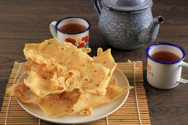 Rempeyek or Peyek Rebon is a Deep Fried Savoury Javanese Cracker Made from Rice flour and Udang Rebon. Popular in Malaysia and Indonesia. Served with Tea