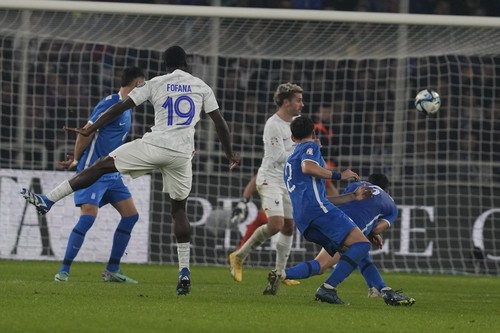 Frances Youssouf Fofana scores during the Euro 2024 group B qualifying soccer match between Greece and France at OPAP Arena in Athens, Tuesday, Nov. 21, 2023. (AP Photo/Thanassis Stavrakis)