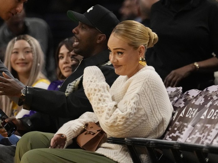 Singer Adele sits with her husband Rich Paul during an NBA basketball game between the Los Angeles Lakers and the Dallas Mavericks Wednesday, Nov. 22, 2023, in Los Angeles. (AP Photo/Marcio Jose Sanchez)