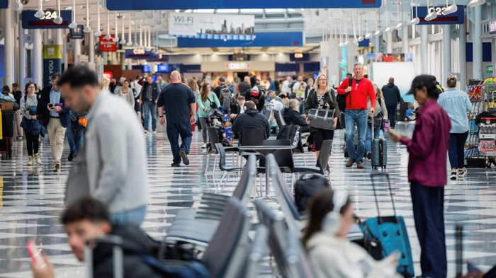 People walk to their flight gates ahead of the Thanksgiving holiday at O’Hare International Airport in Chicago, Illinois, U.S. November 22, 2023.  REUTERS/Vincent Alban     TPX IMAGES OF THE DAY