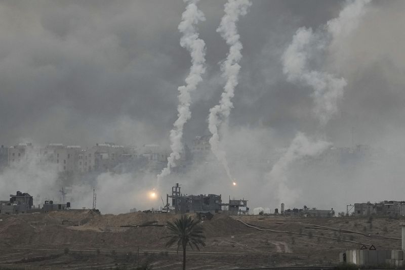 Smoke rises following an Israeli airstrike in the Gaza Strip, as seen from southern Israel, Wednesday, Nov. 22, 2023. (AP Photo/Leo Correa)