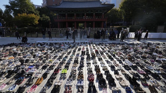About 2,000 pairs of shoes symbolizing all the victims from Gaza, West Bank and Israel are placed before a rally in Seoul, South Korea, Friday, Nov. 17, 2023. About 2,000 pairs of shoes are donated by people who stands in solidarity and placed by members of civic groups in downtown Seoul.(AP Photo/Lee Jin-man)