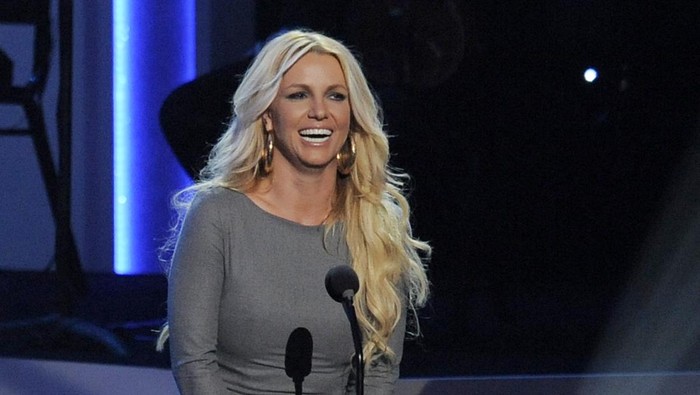Britney Spears speaks onstage at 