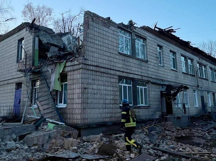 This handout photograph taken and released by Ukrainian Emergency Service on November 25, 2023, shows a rescuer working at the site of a drone attack in Kyiv. Ukraine said on November 25, 2023 it had downed 71 Russian attack drones overnight in what Kyiv authorities said was the biggest attack on the capital since the start of the invasion. (Photo by Handout / UKRAINIAN EMERGENCY SERVICE / AFP) / RESTRICTED TO EDITORIAL USE - MANDATORY CREDIT 