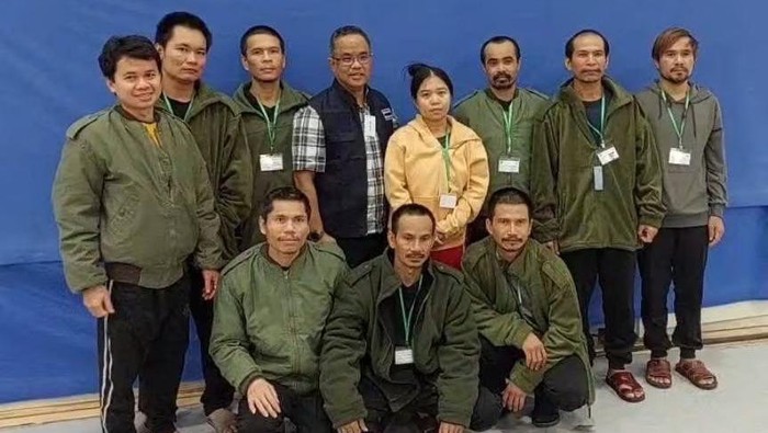 Thai workers taken hostage by Hamas and later released as part of a deal between Israel and Palestinian Islamist group Hamas, pose with a member of Thai mission after a medical checkup, in Tel Aviv, Israel, in this handout image released on November 25, 2023. Ministry Of Foreign Affairs Thailand/Handout via REUTERS Acquire Licensing Rights