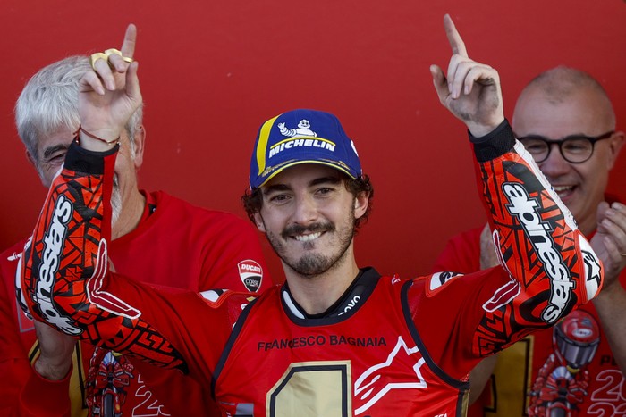 Moto GP World Champion Italian rider Francesco Bagnaia of the Ducati Lenovo Team, center, celebrates after the MotoGP race of the Valencia Motorcycle Grand Prix, the last race of the season, at the Ricardo Tormo circuit in Cheste near Valencia, Spain, Sunday, Nov. 26, 2023. (AP Photo/Alberto Saiz)
