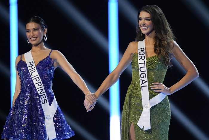 Miss Philippines Michelle Dee, left, and Miss Portugal Marina Machete compete during the final round of the 72nd Miss Universe Beauty Pageant in San Salvador, El Salvador, Saturday, Nov. 18, 2023. (AP Photo/Moises Castillo)